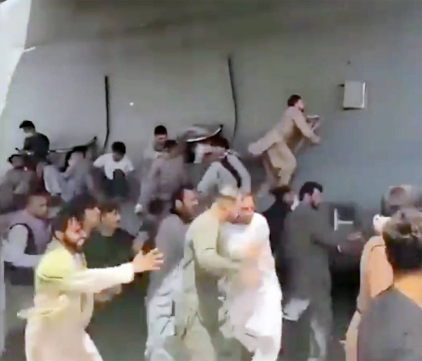 Videograb of panic at Kabul airport as European nations evacuate nationals and others.