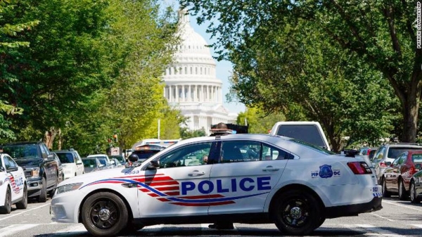 A Metropolitan Police Department cruiser blocks a street near the US Capitol and a Library of Congress building in Washington on Thursday, as law enforcement officials investigate a report of a pickup truck containing an explosive device. — courtesy photo