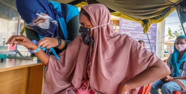 After a seven-month ordeal at sea, a Rohingya refugee is registered at a site in Aceh province, Indonesia. — courtesy UNHCR/Jiro Ose