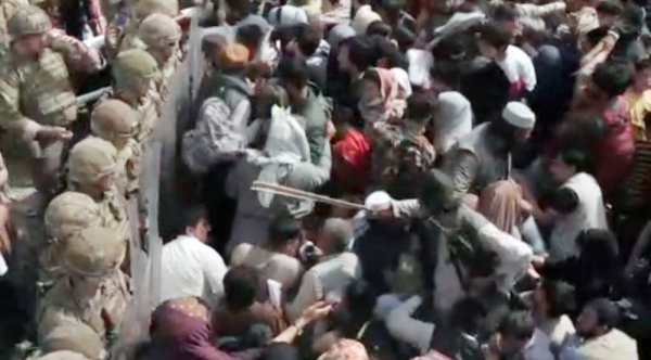 US marines provide assistance during an evacuation at Hamid Karzai International Airport in Kabul, Afghanistan, Friday.