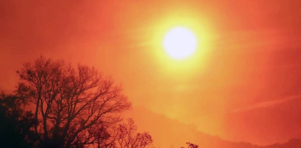 
The sun rises over a smoldering landscape that was burned by a wildfire dubbed the Cave Fire, burning in the hills of Santa Barbara, California, US, in this Nov. 26, 2019, file photo. — courtesy Reuters/David McNew 