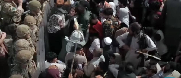 A standoff between Afghan people fleeing the country and Western forces at the Kabul Airport.