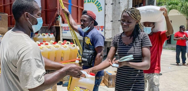 Food is distributed to 3,000 people in Camp Perrin, one of the areas in the south of Haiti that was affected by the earthquake. — courtesy WFP/Marianela González