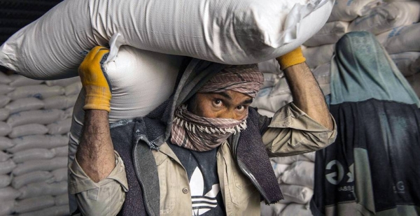 Grain is loaded for distribution at a World Food Program warehouse in Kabul in May 2021. — courtesy WFP/Arete/Andrew Quilty