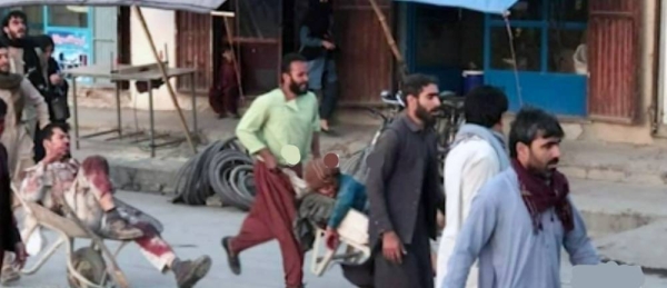 Videograb of Afghanis rushing the injured in wheelbarrows for aid following two explosions outside the Kabul airport on Thursday.