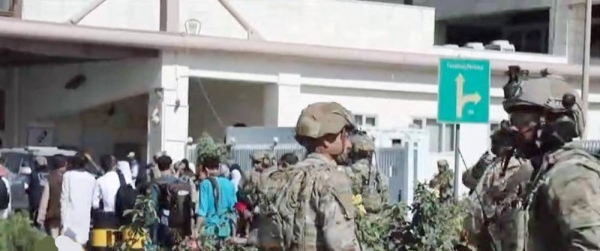 US Marines stand guard at the Kabul airport as evacuations restarts following the deadly twin explosions that killed 13 US serviceman and 90 Afghanis.