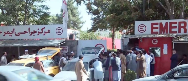 Afghans are seen taking the bodies of the killed relative in the Kabul Airport blasts. Reports on Friday raised the overall death toll from Thursday's attack to at least 169.