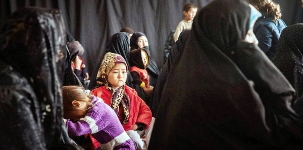 A community in an isolated area of Afghanistan relies on mobile clinics run by humanitarian agencies for primary health care. — courtesy IOM