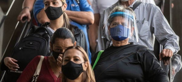 People wear face masks in Medellin, Colombia, to prevent the spread of COVID-19. — courtesy IMF/Joaquin Sarmiento