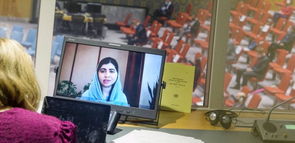 A screen in an interpreter's booth shows Malala Yousafzai addressing the UN Security Council meeting on Afghanistan, on 9 September, 2021. — courtesy UN Photo/Manuel Elías