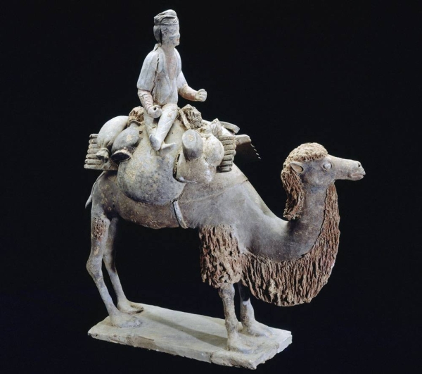 Funerary figure (mingqi), caravanner on a camel. — courtesy RMN-Grand Palais (Mnaag, Paris) Thierry Ollivier