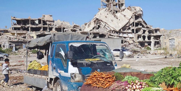 Vegetables are sold amidst the rubble of the old town of Benghazi in Libya. — courtesy UNOCHA/Giles Clarke