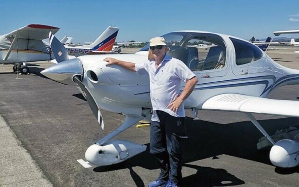 Haim Geron stands next to a light plane. — courtesy Facebook