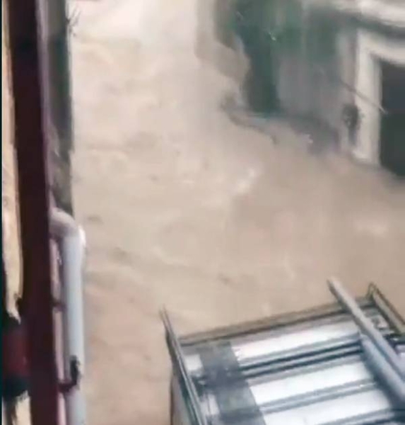 Videograb of flash floods turning into roads into rivers as heavy rains lash southern France Wednesday.