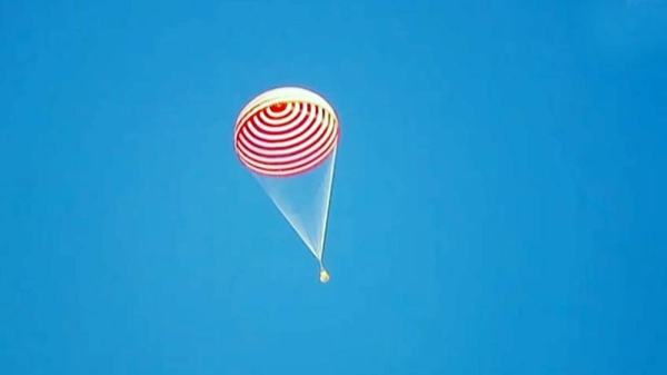 The three taikonauts from China's Shenzhou-12 manned spaceflight mission made their first appearance out of the re-entry capsule after safely landing back on Earth local time on Friday afternoon.