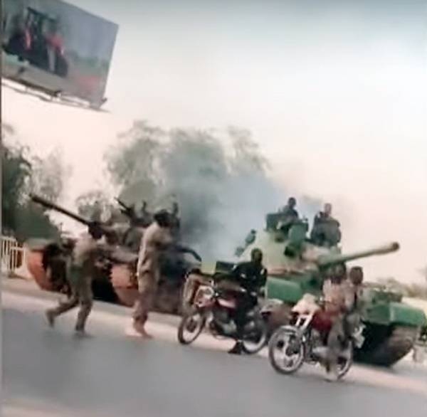 Videograb of Sudanese soldiers guarding a road, following a  coup attempt on Tuesday by a group of soldiers. Authorities said that military remains in control. 