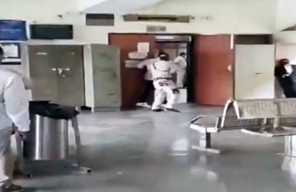 Videograb of a shootout between police and gangsters at the New Delhi court is ongoing on Friday.
