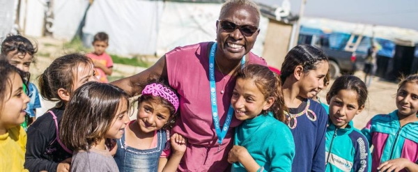 UNICEF Goodwill Ambassador Angelique Kidjo engages with children in the Housh el Refka informal settlement, in Lebanon's Bekaa Valley. — courtesy UNICEF/Diego Ibarra Sanchez