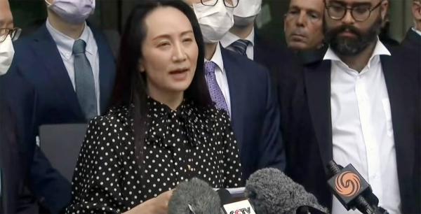 Huawei executive Meng Wanzhou, arrested on a US warrant in 2018, speaks to the press before leaving Canada on Friday in a deal with US prosecutors.