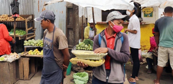 Vendors sell vegetables in a market in Antananarivo, the capital of Madagascar. — courtesy ILO Photo/E. Raboanaly