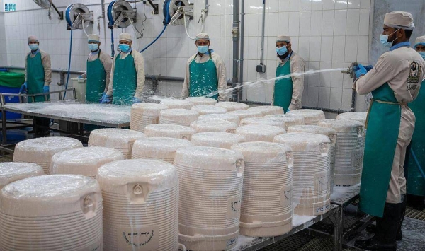 Workers at the Grand Mosque in Makkah use the most modern equipment to keep the Zamzam containers clean.