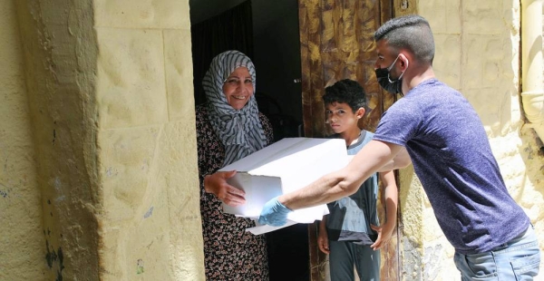 Many families in Gaza need humanitarian aid to survive and receive food parcels from the UN agency working in the region, UNRWA. — courtesy UNRWA/Hussein Jaber