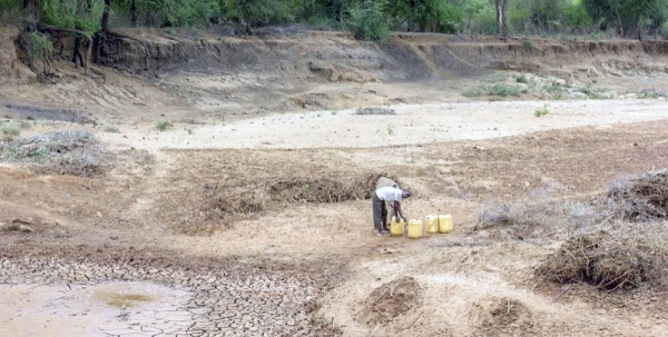 A person searches for water at a dry riverbed in eastern Kenya. — courtesy World Bank/Flore de Préneuf