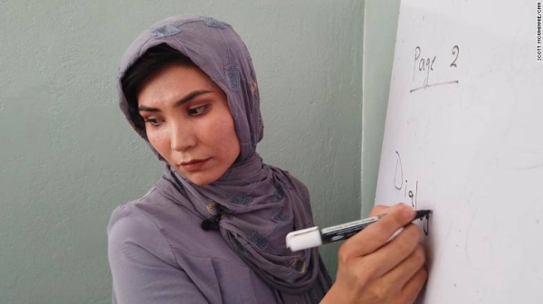 Atifa Watanyar teaches a class of young girls at the Sayed Al-Shuhada school in the outskirts of Kabul.