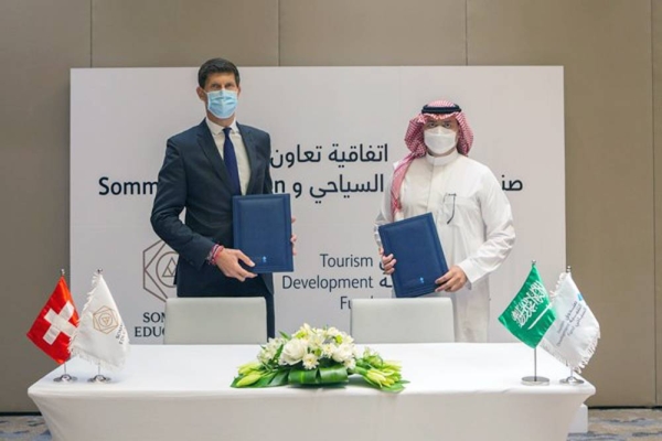 Benoît-Etienne Domenget, CEO Sommet Education, and Qusai Al-Fakhri, chief executive officer of TDF, at the signing ceremony.