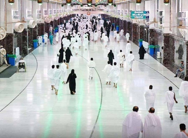 A Muslim boy performs Al-Fajr prayer Sunday at the Grand Mosque amid atmosphere full of faith.