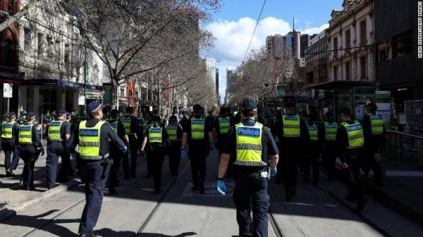 A heavy Victoria Police presence is seen as anti-lockdown protesters take to the streets on August 21 in Melbourne, Australia.