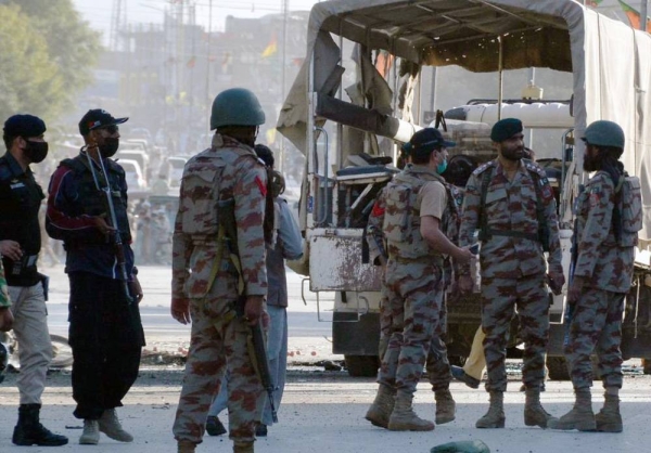 Security personnel examine the blast site in southwest Pakistan's Quetta on Monday. — courtesy Xinhua