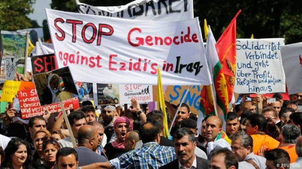 This file photo shows several thousand people marching in a major demonstration organized by Germany's Yazidi community in the town of Bielefeld.