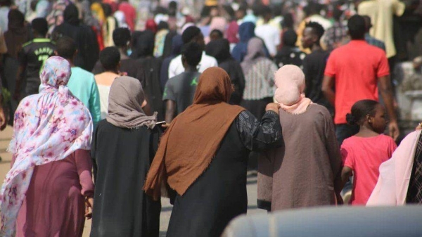 Thousands of people, including many women and children, protested outside the military compound in Khartoum.