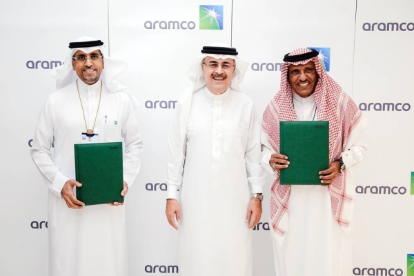 Aramco President and CEO Amin H. Nasser, center, over sees the MoUs signed by Aramco Tuesday as it plans to expand its focus on emerging sectors to drive private sector innovation and investment.