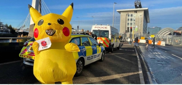 An activist dressed as Pikachu demonstrates outside COP26, the UN Climate Conference, taking place in Glasgow, Scotland.