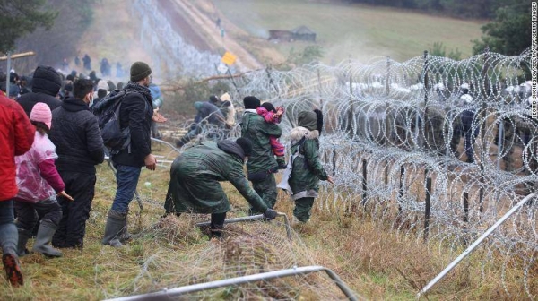 A picture taken on Monday shows migrants at the Belarusian-Polish border in the Grodno region.