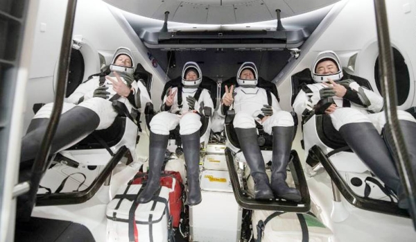 


ESA (European Space Agency) astronaut Thomas Pesquet, left, NASA astronauts Megan McArthur and Shane Kimbrough, and Japan Aerospace Exploration Agency (JAXA) astronaut Aki Hoshide, right, are seen inside the SpaceX Crew Dragon Endeavour spacecraft onboard the SpaceX GO Navigator recovery ship shortly after having landed in the Gulf of Mexico off the coast of Pensacola, Florida, Monday, Nov. 8, 2021. — courtesy NASA/Aubrey Gemignani