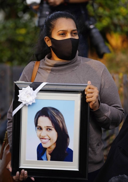 Wishma Sandamali's younger sister Poornima speaks to reporters before filing a criminal complaint with the Nagoya District Public Prosecutors Office on Nov. 9, 2021.