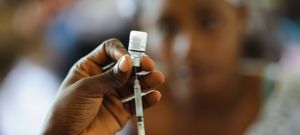 A nurse fills a syringe with a vaccine at the Elmina Urban Health Centre in the Central Region of Ghana.