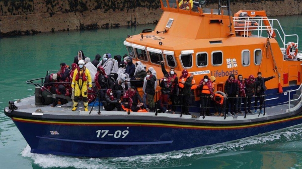 RNLI boat carrying people picked up from a small boat in the Channel.