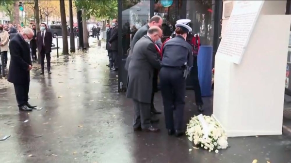 French officials lay wreaths outside the Bataclan concert venue commemorating the 6th anniversary of the Paris terror attacks on Nov. 13 2015.