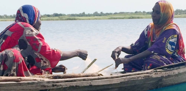 
Fisherwomen like Falmata Mboh Ali (right) hard at work on Lake Chad, which has shrunk to a tenth of its original size over the past decades leaving dwindling stocks of fish (file photo). — courtesy UN News/Dan Dickinson