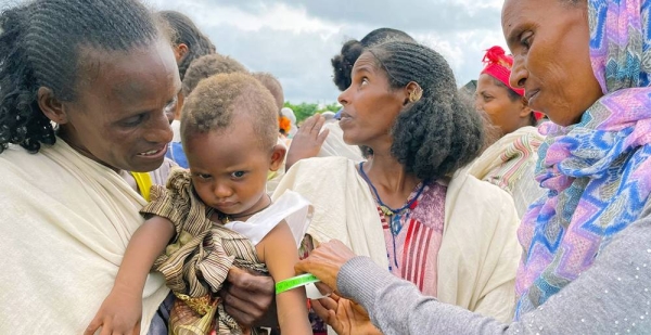 
A young child is screened for malnutrition at a food distribution site in Tigray, northern Ethiopia. — courtesy WFP/Claire Nevill