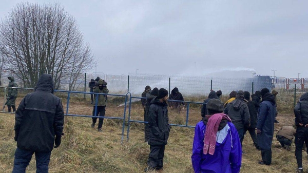 Polish forces use water cannon at the border with Belarus.