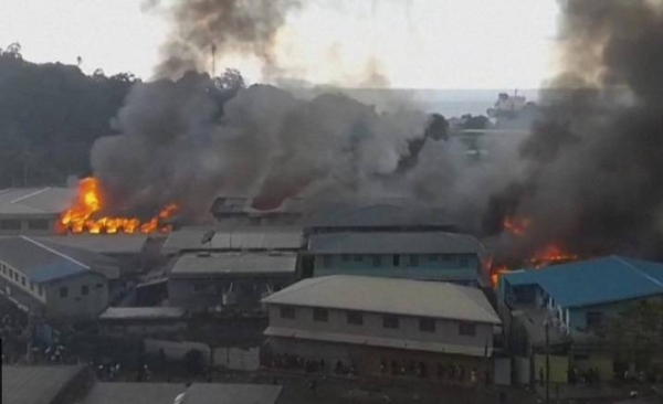 Pictures posted on social media showed government buildings and businesses in Chinatown set ablaze.