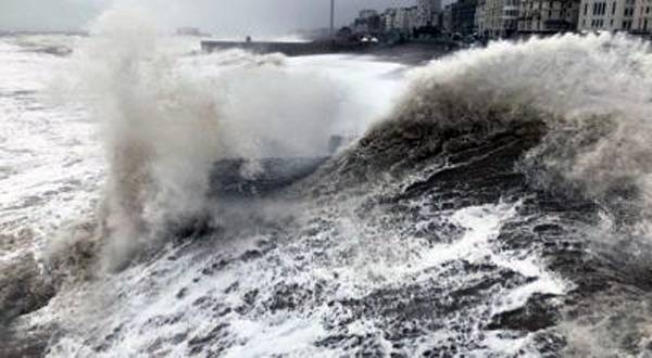 Photo shows raging seas in Brighton. Two men were killed by falling trees as Storm Arwen lashed the northern parts of the UK.