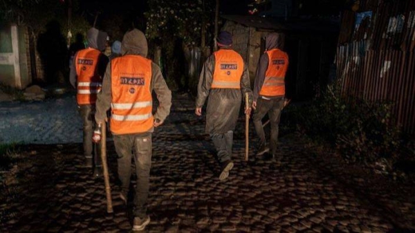 Volunteers conduct a night patrol on the lookout for suspicious activity in the Ethiopian capital.