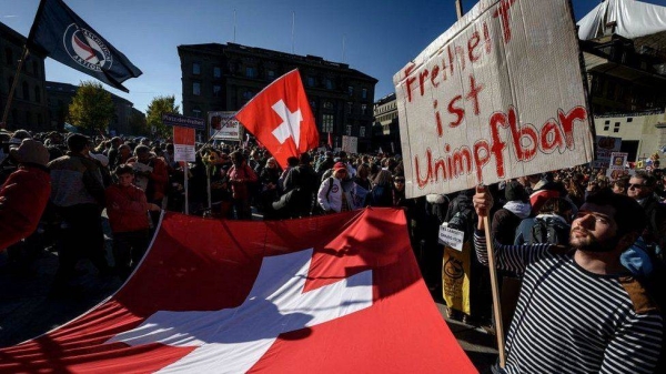 Anti-vaccination protesters have taken to the streets of Bern ahead of the vote.