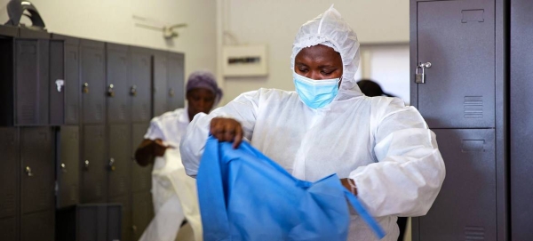 A nurse at the special COVID-19 Field Hospital in Nasrec, Johannesburg, puts on her PPE.